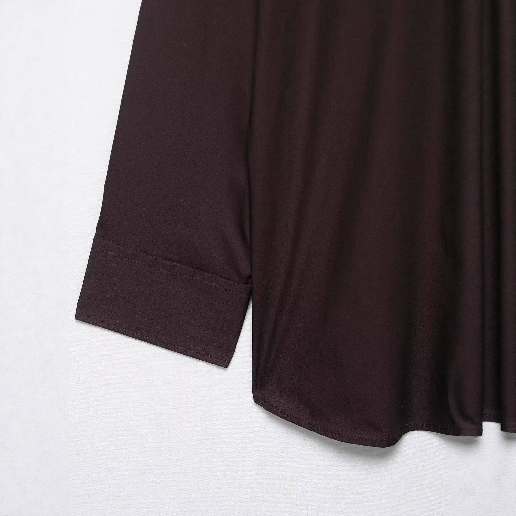 Brown women's cardigan-style shirt with long sleeves and a built-in bow tie scarf detail