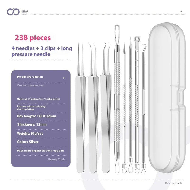 Four silver metal acne needles with pointed tips laid out on a flat surface.