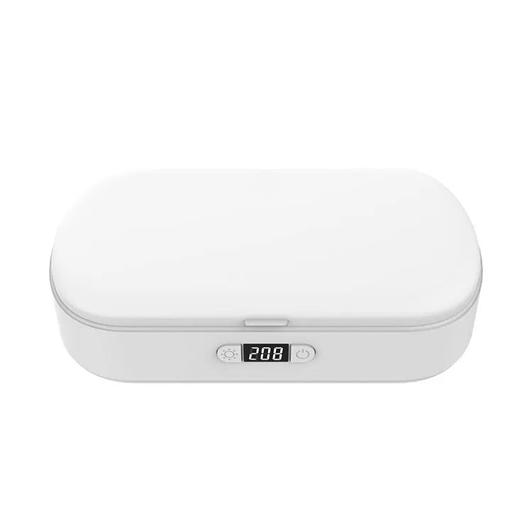 White ABS UV steriliser box with wireless charging for phones and jewellery on a plain background.