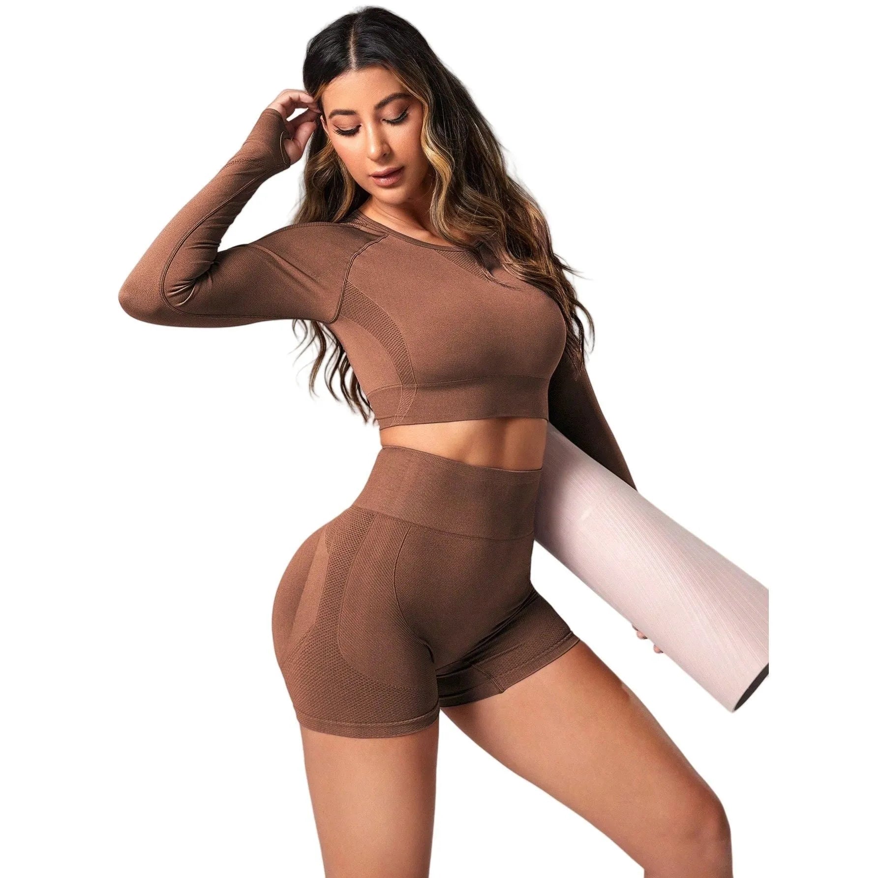 Women's black yoga suit set with long sleeve top and high-waisted tights on a mannequin.