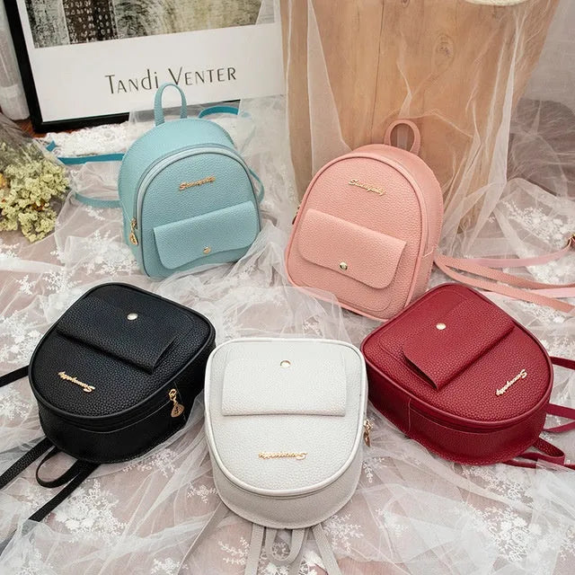 Small black PU leather women's shoulder backpack with zip, shown as a letter-style purse.