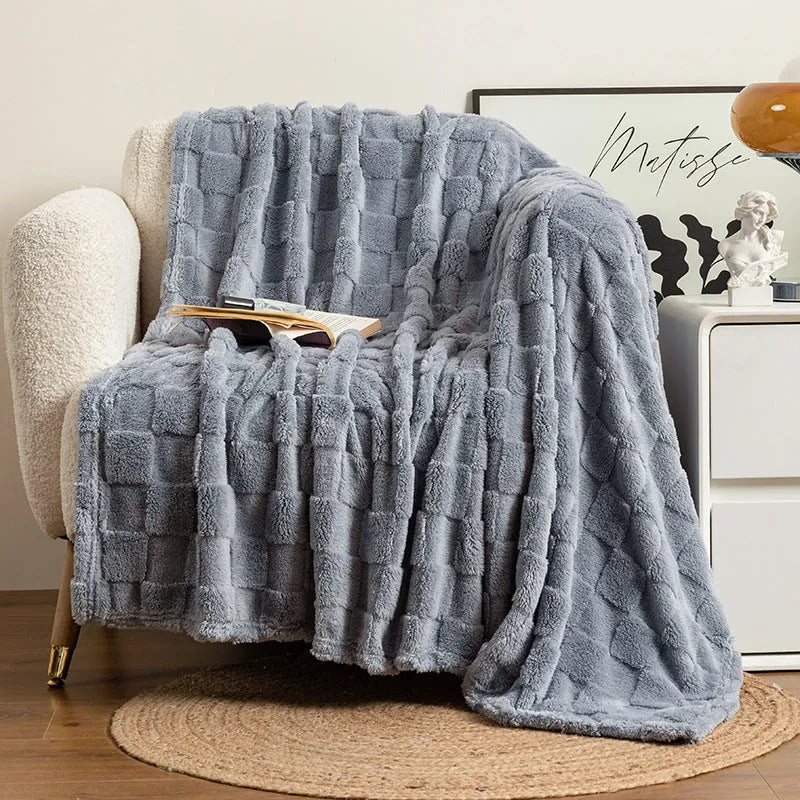 Geometric patterned polyester blanket in milky white showing cotton velvet texture and thickened construction