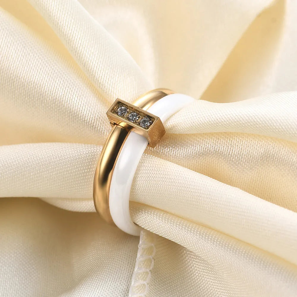 Ceramic ring with geometric shape and zirconium stitching in steel black or golden white colour