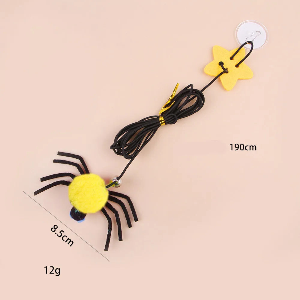 Cat hanging door toy with red feather and bell spider dangling from elastic rope