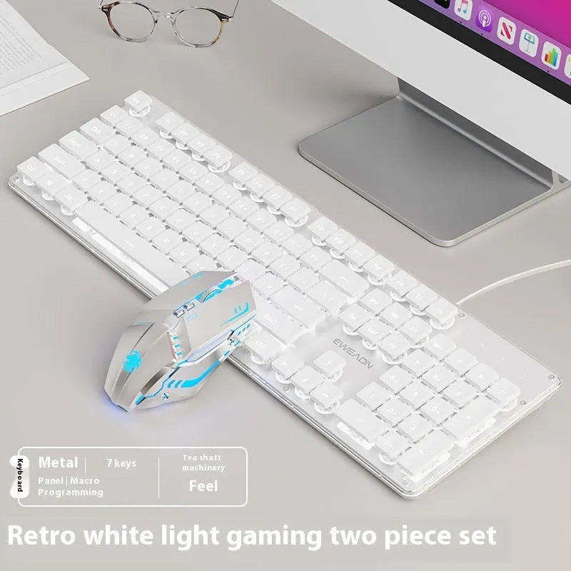 Wired computer keyboard with mute button and blue backlighting on a desk
