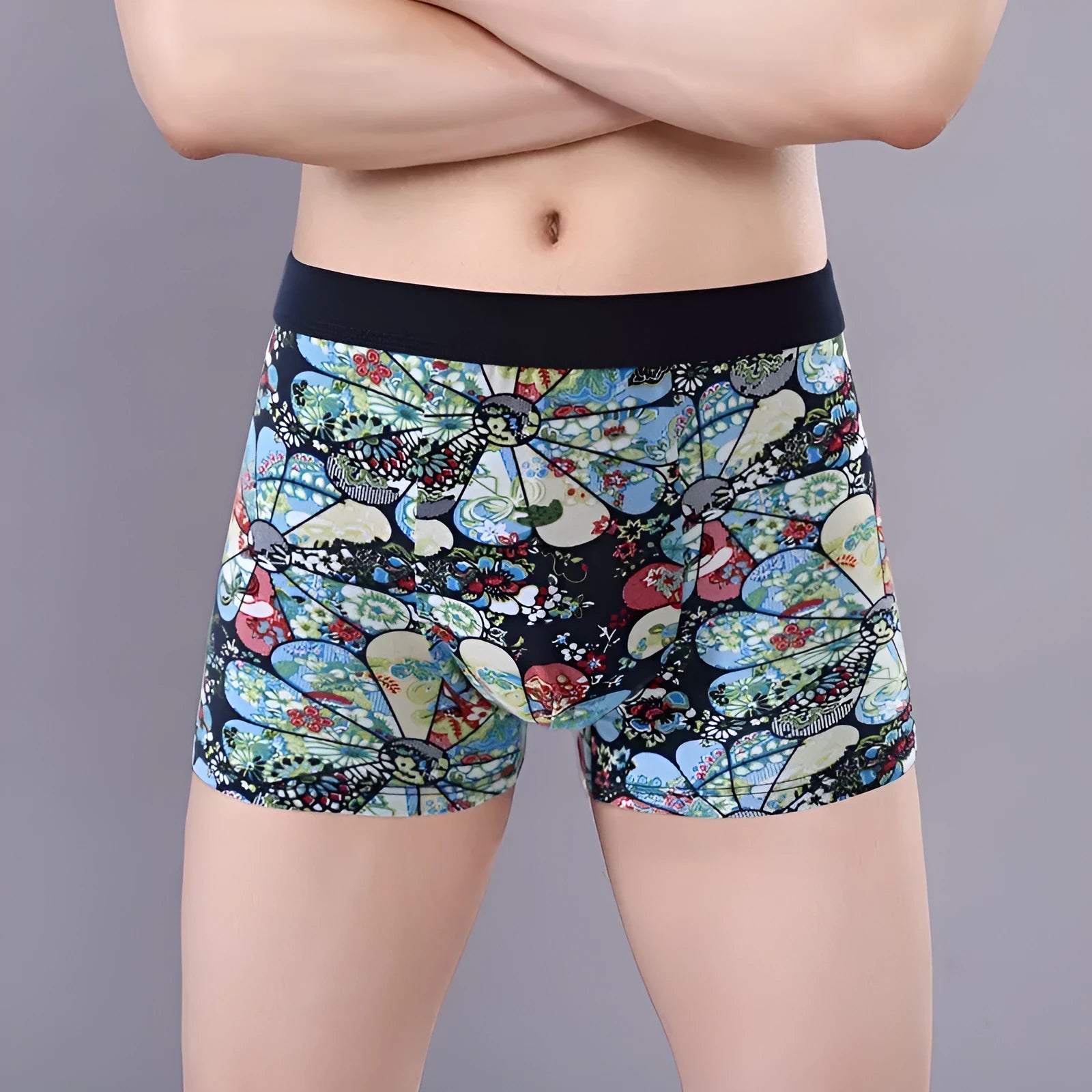 Men's cotton boxer briefs on a white background, showing the U-shaped pouch design and a floral pattern.