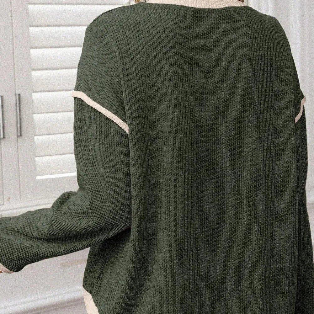 Loose drop shoulder knit top with four leaf clover contrast trim at collar and sleeves