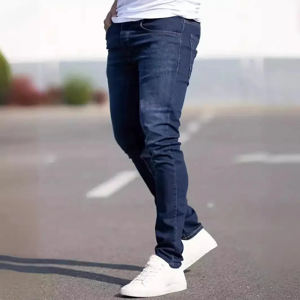 Men's dark blue slim casual jeans with medium elastic waist and skinny leg style