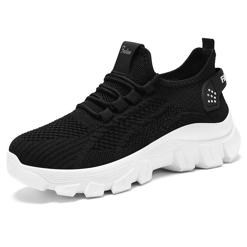 Women's white Flyknit sneaker with thick PVC sole and round toe lace-up design