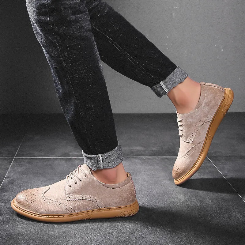 Men's black genuine cowhide leather lace-up business shoes with rubber sole on a grey background.