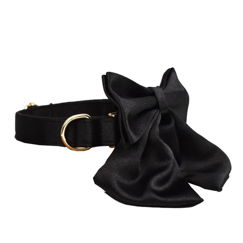 Fabric dog collar and lead set with matching chest strap vest and decorative bow tie.