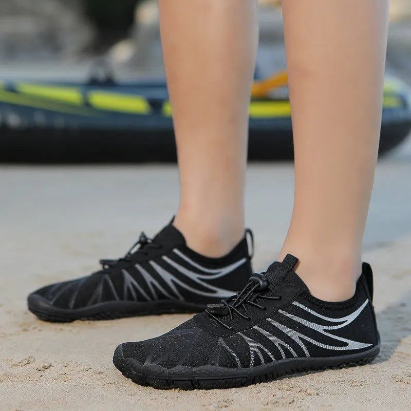 Low-top unisex casual sports running shoe in multiple colours with a lace-up front and rubber sole.