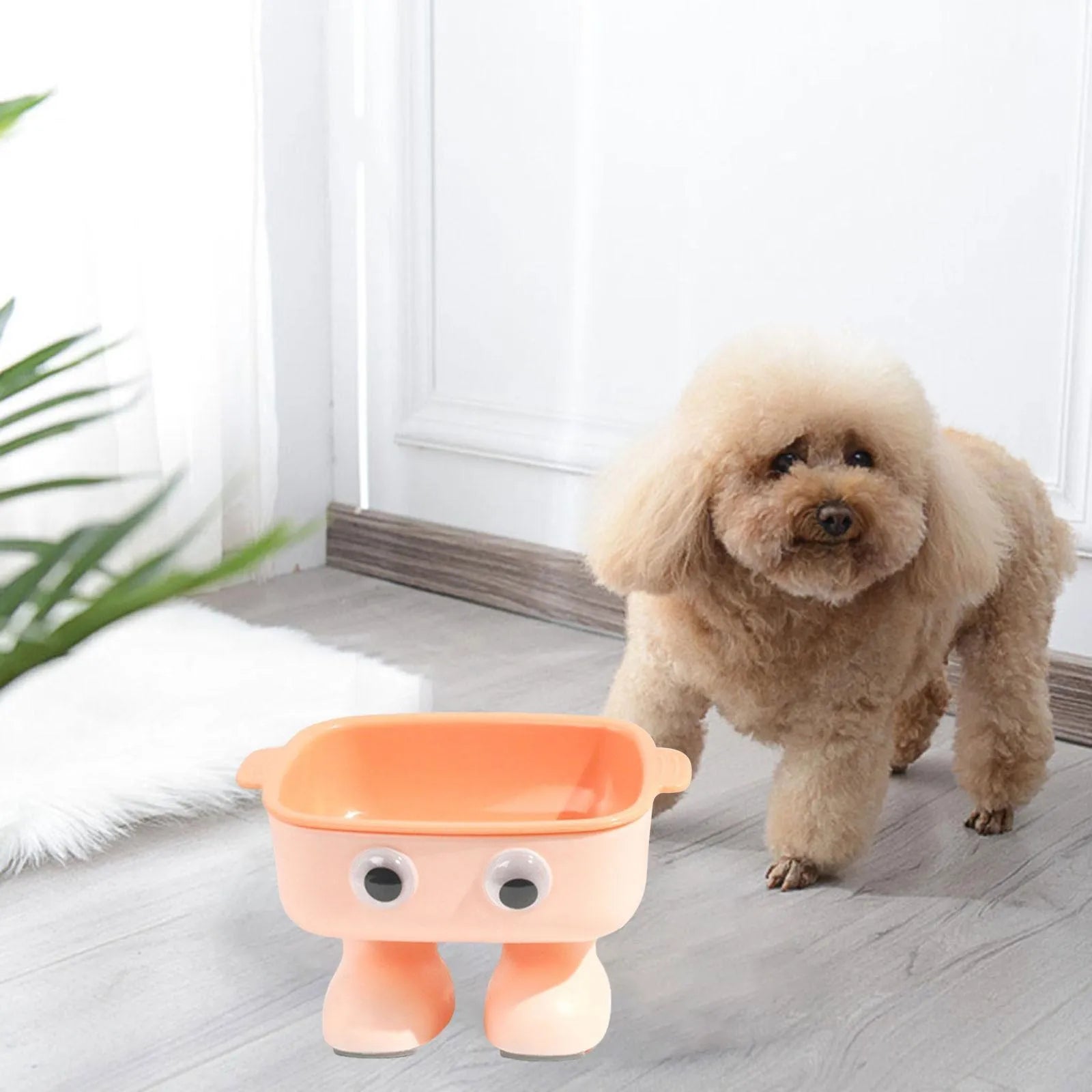 Green robot-shaped elevated cat bowl with tilted design and detachable inner component