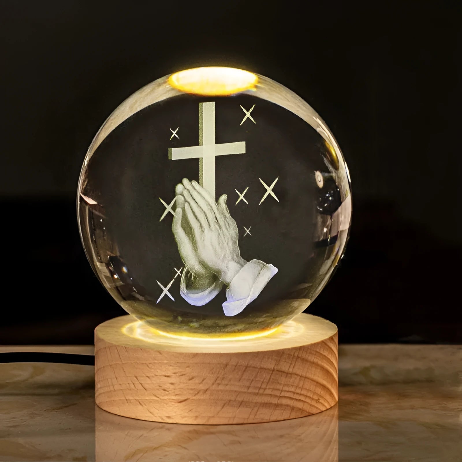 White crystal lamp with 6cm diameter orb on solid wood warm light base showing religious ornamentation