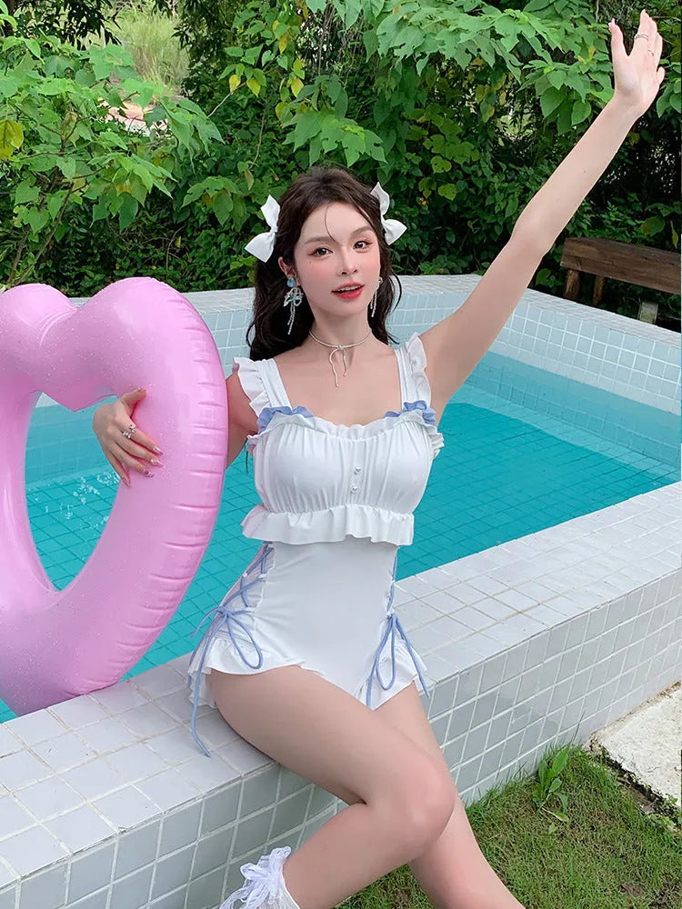 Milky white backless one-piece swimsuit for women, sleeveless nylon design for swimming and fitness