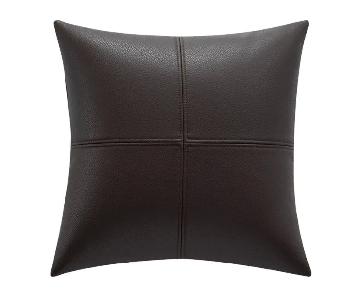 Soft cowhide leather pillow cover in a solid colour, shown in a Nordic-style room setting.