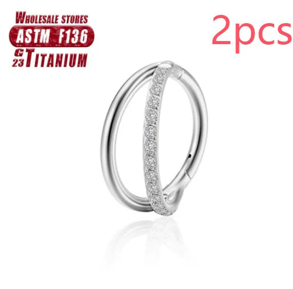 Titanium alloy fork nose ring in silver colour on a plain background, showing its shape and size.
