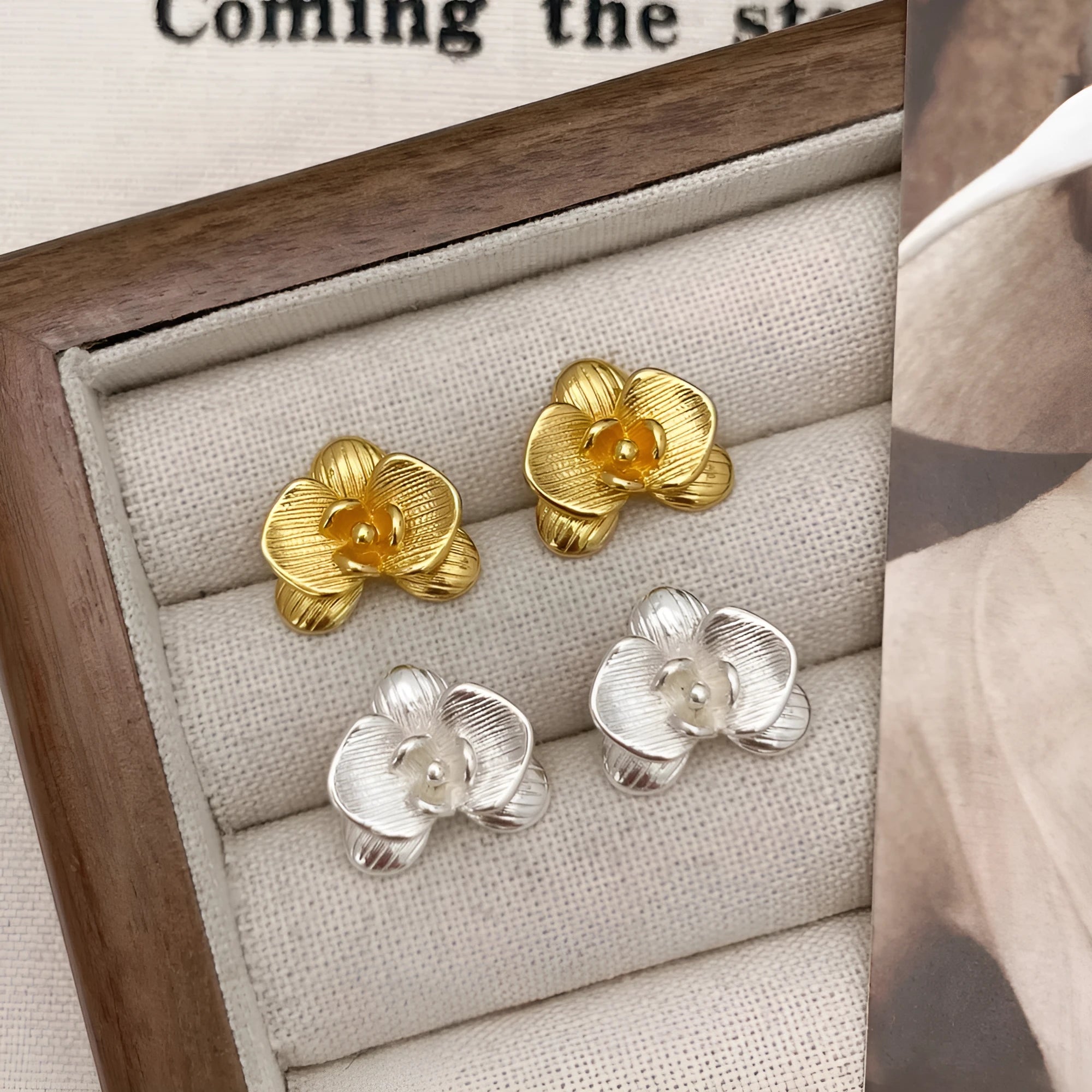 Retro flower fashion earrings in gold or silver electroplated finish with petal details