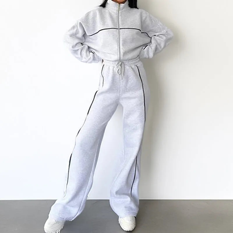 Casual two-piece suit set with a grey hoodie and striped lace-up trousers on a hanger