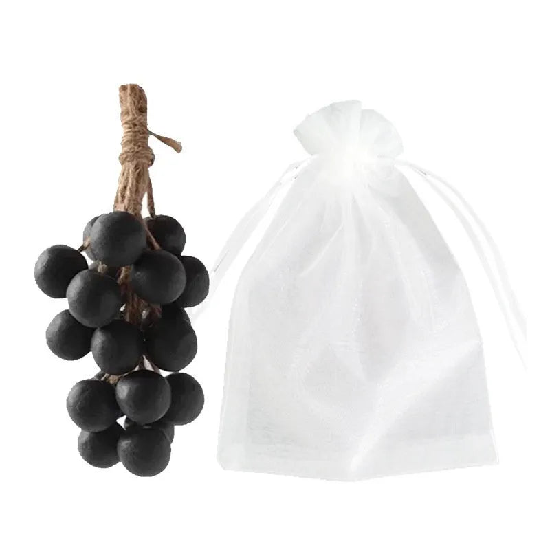 Handmade grape soap bars in black, green, and purple grape scents alongside litchi soap, with gift box and mesh bag packaging