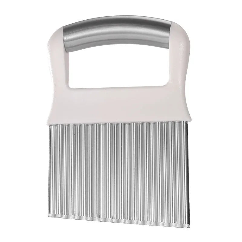 Stainless steel potato wave knife with serrated blade on a kitchen counter.