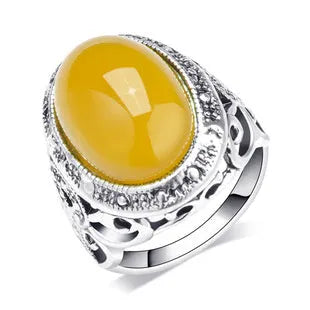Geometric antique silver amber alloy ring with retro design on a hand.