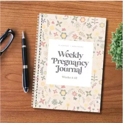 A5 pregnancy weekly diary notebook open showing weekly tracking pages