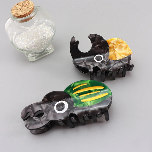 Handmade cellulose acetate insect biology beetle grip in green beetle design