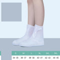 White PVC high top reusable waterproof shoe covers for women with anti-skid soles