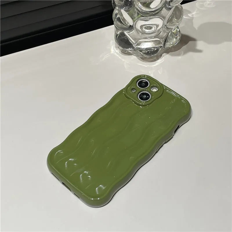 Silicone iPhone 17 case with water ripple texture in green colour showing soft-shell protective design