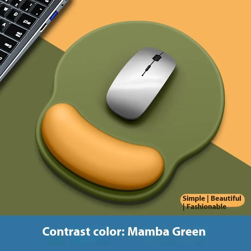 Silicone mouse mat with wrist rest in gradient colour pattern on desk