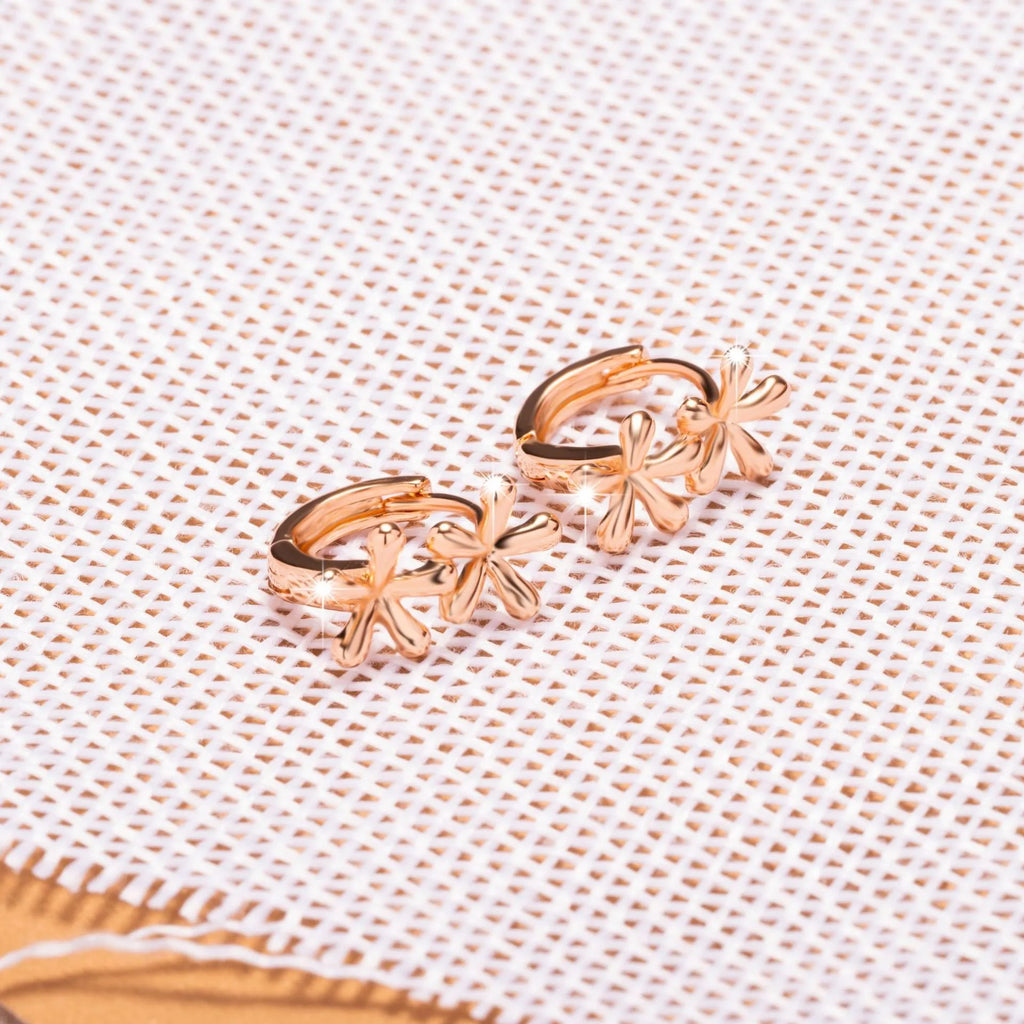 Circular rose gold earrings with a waterdrop flower design for women.