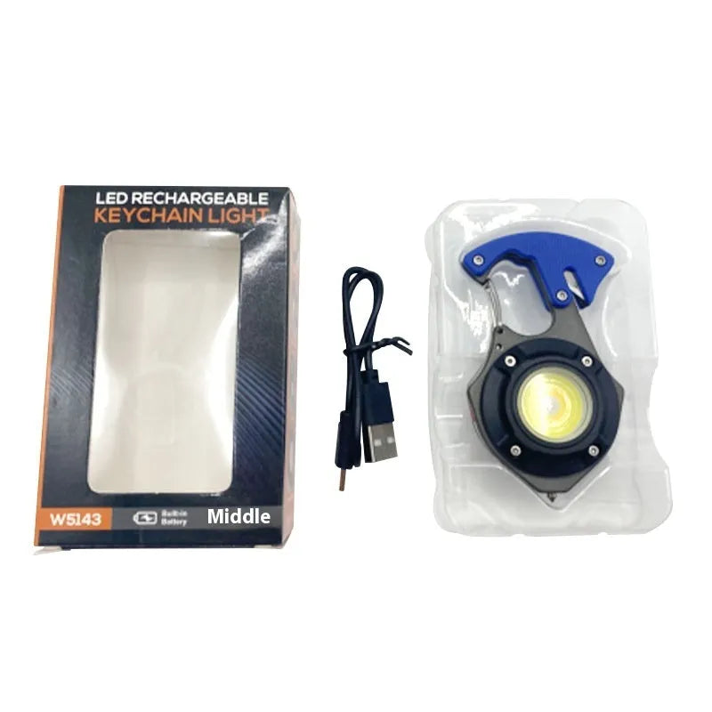 Compact multifunctional keychain torch showing COB light array, keyring, and built-in window breaker and screwdriver tools.