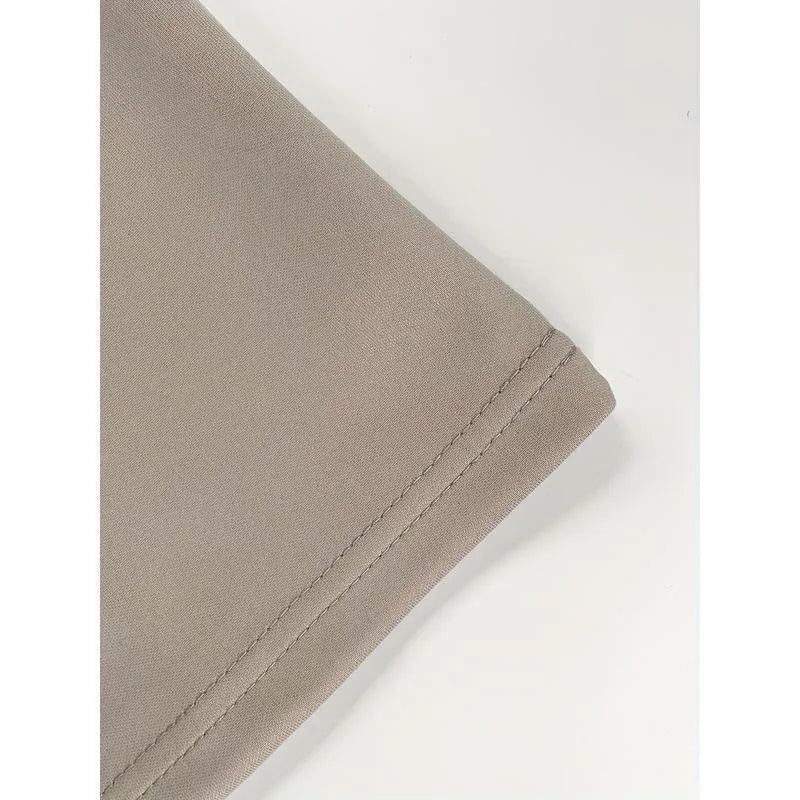 Pack of three men's solid colour loose-fit corduroy trousers on a hanger.