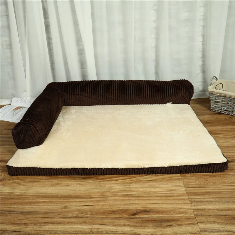 Corduroy dog bed sofa with bolster sides and non-slip base in a neutral colour.