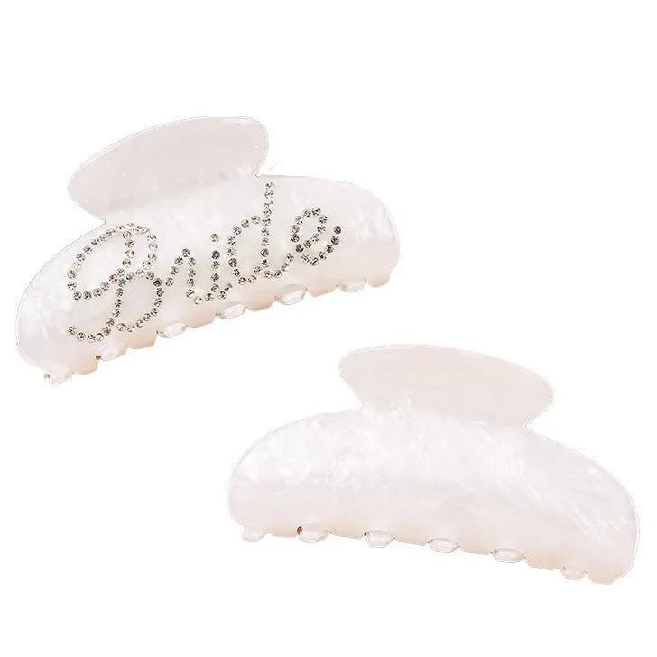 Pink and white acrylic barrette hair clip with diamond spot drilling and English letters.