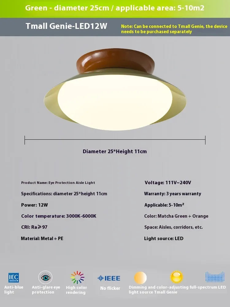 Modern flying saucer shaped ceiling lamp with an iron shade, shown in a cream yellow finish.