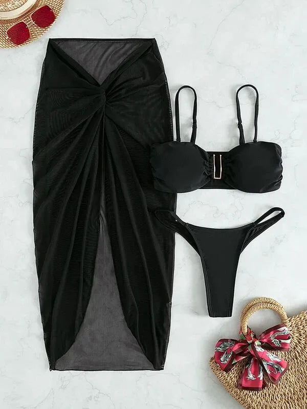 Women's multicolour French-style three-piece bikini set with a long culotte skirt on a hanger.
