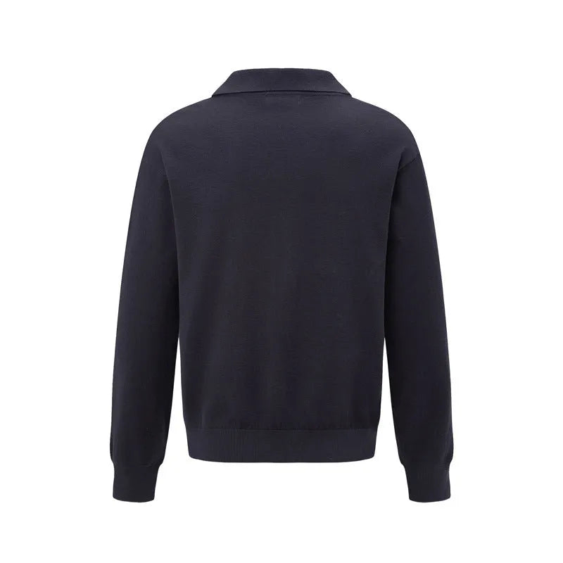 Man wearing a loose black acrylic blend pullover bottoming shirt for casual leisure wear.