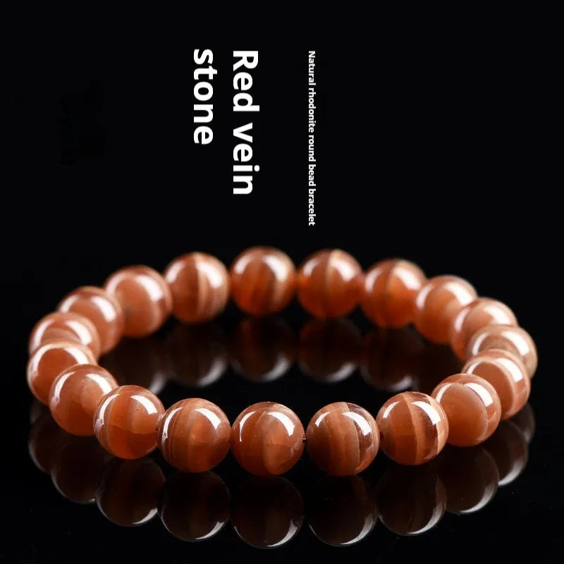 Natural Old Mine Rhodochrosite round beads bracelet from Peru with geometric design