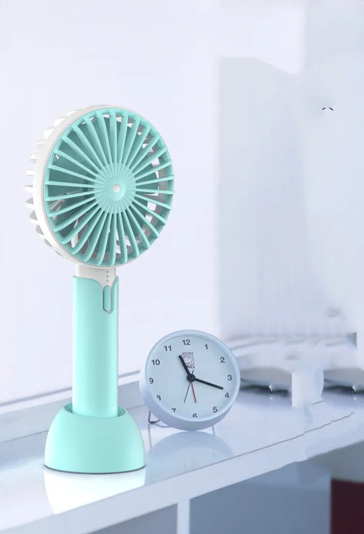 Blue mini silent desktop USB electric fan with three-speed control on a desk