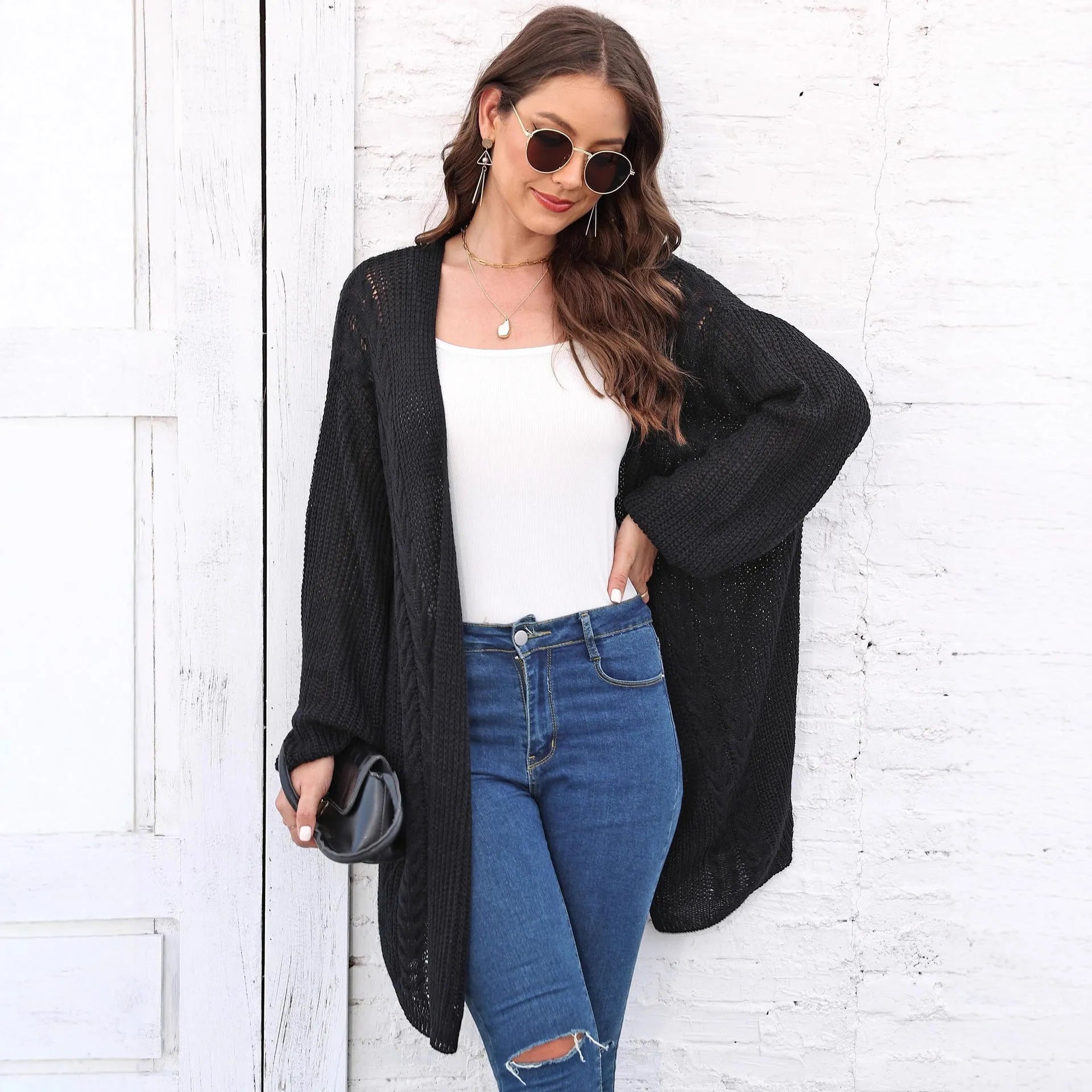 Women's loose fit acrylic sweater coat in army green, shown front on, casual style.