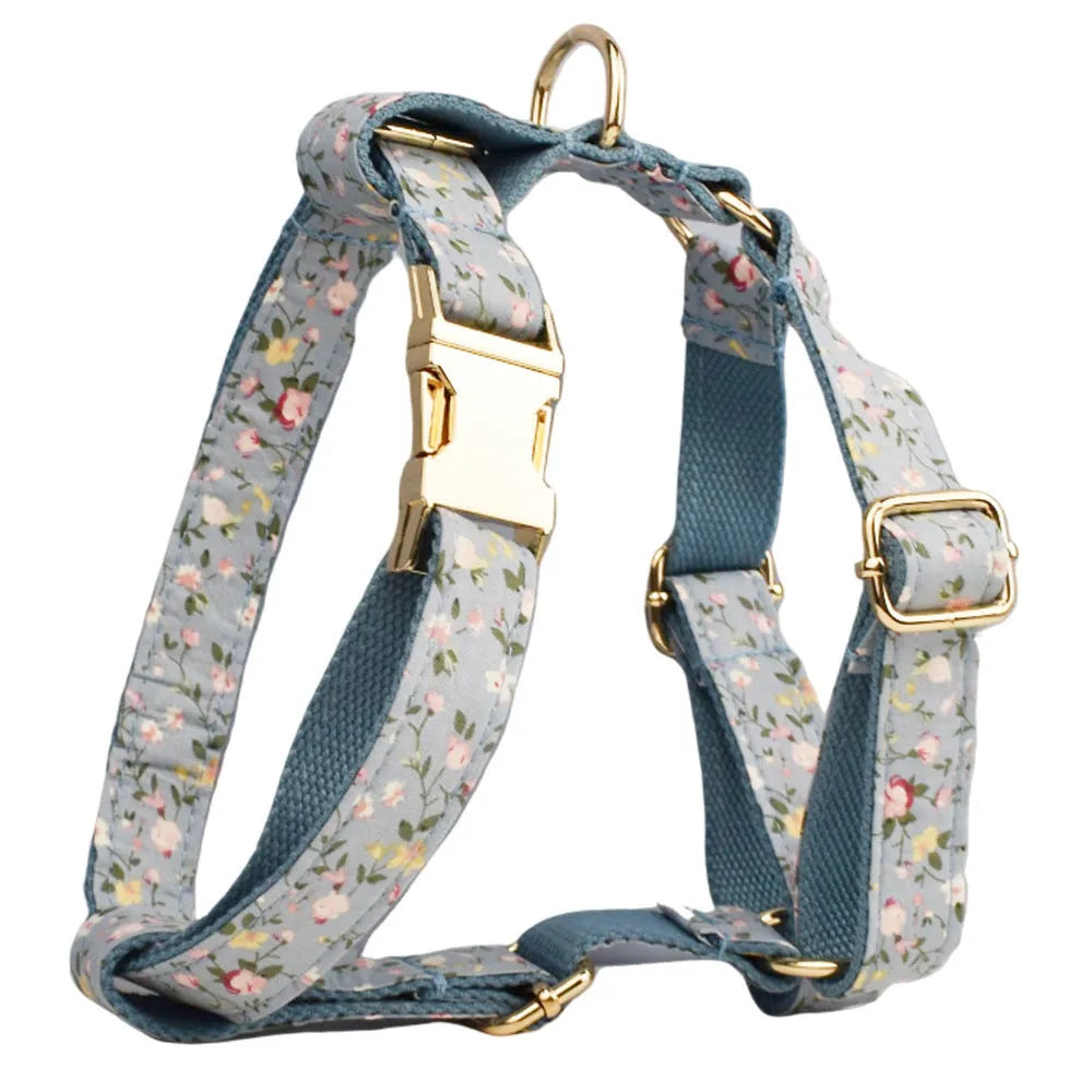 Blue floral pattern dog collar set with matching accessories including bow, leash and vest