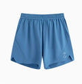 Black and blue four-point stretch running shorts with laser-cut stitching detail on a mannequin.