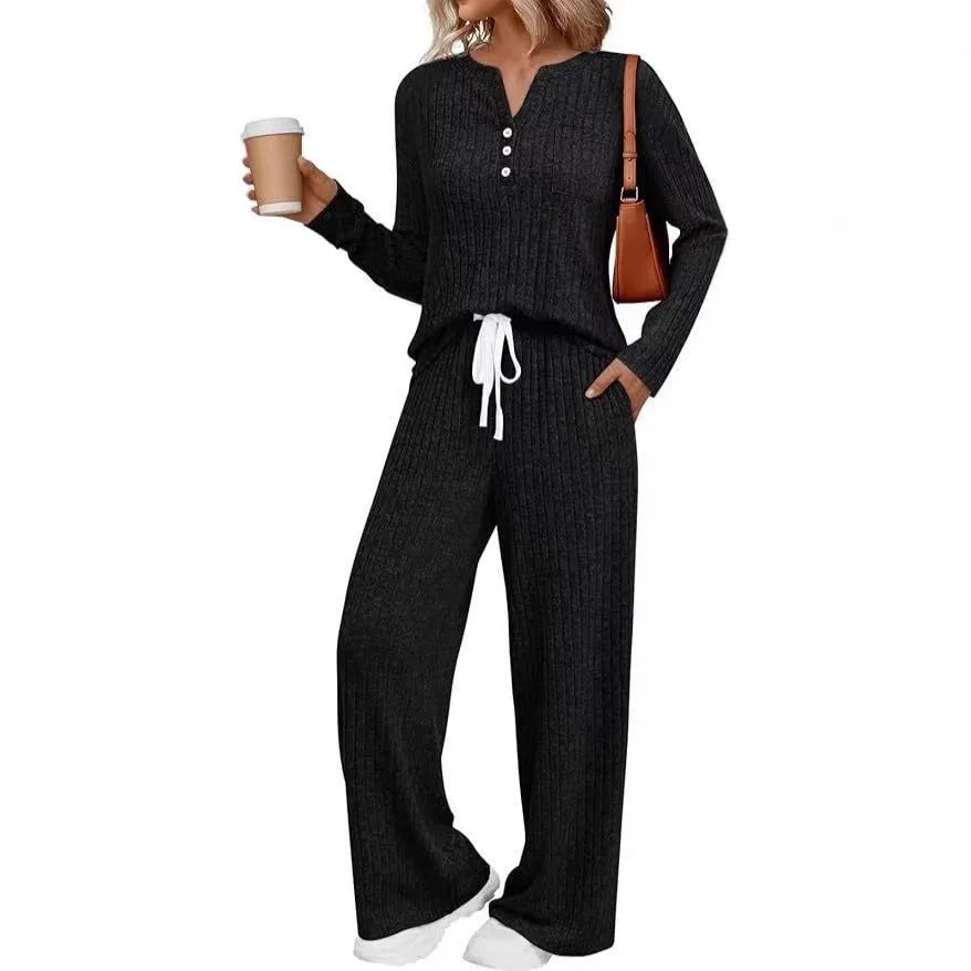 Women's striped knit V-neck long coat in light grey with matching pants, showing lace-up details