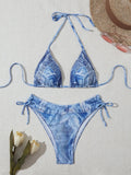 Women's denim blue printed bikini set with adjustable straps on mannequin