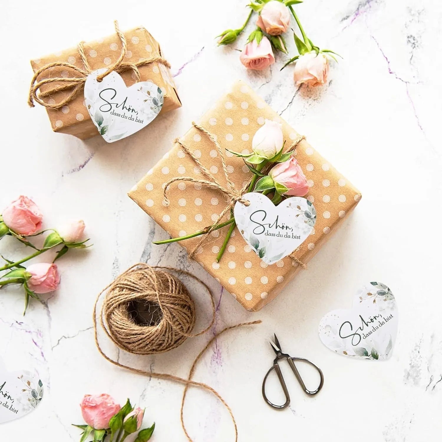 Set of 50 floral heart-shaped paper gift tags in two colour variations.