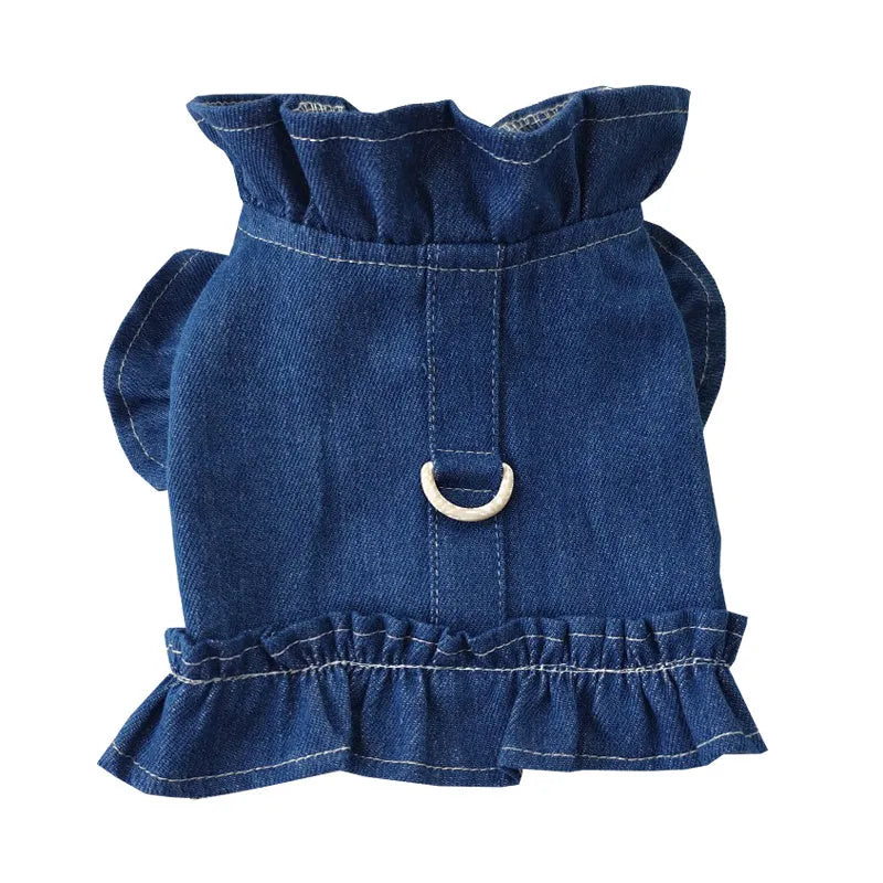 Blue denim dog dress with ruffles and integrated leash hooks on the chest and back.