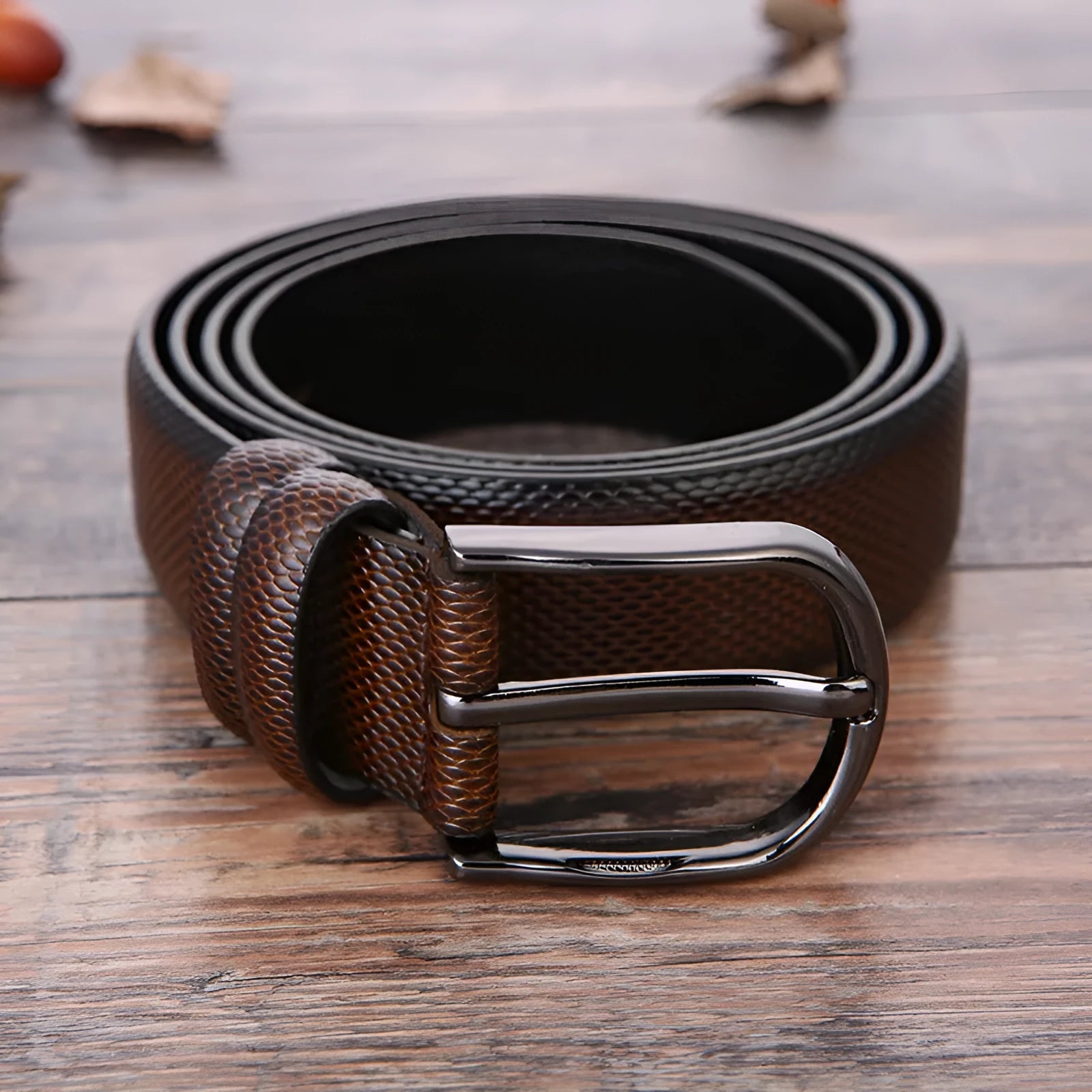 Men's business belt showing laser pattern detail with alloy pin buckle on imitation leather strap