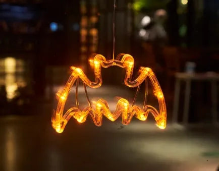 Set of seven Halloween-themed LED hanging lights with suction cups for window display
